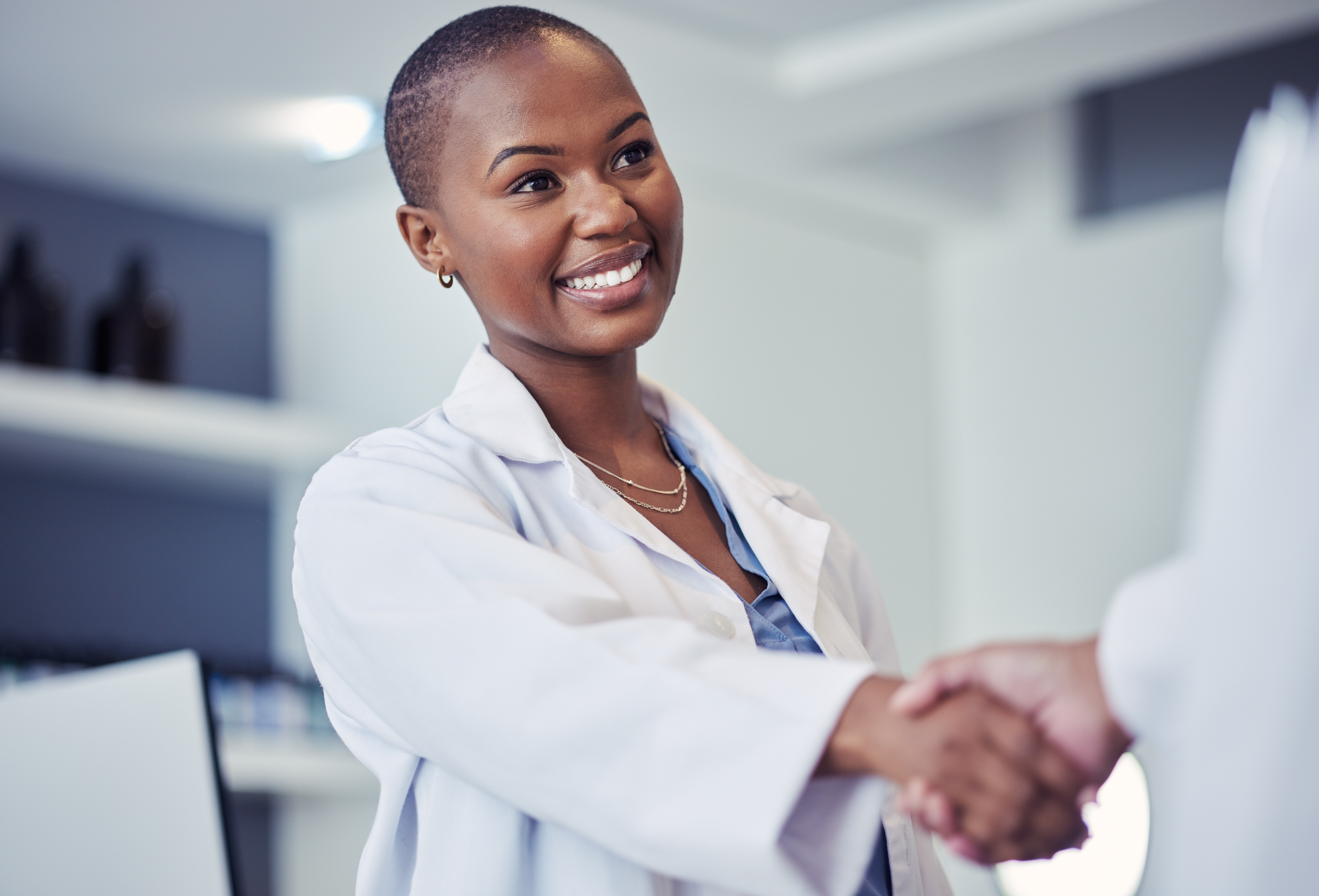 Doctor reaching hand out to shake