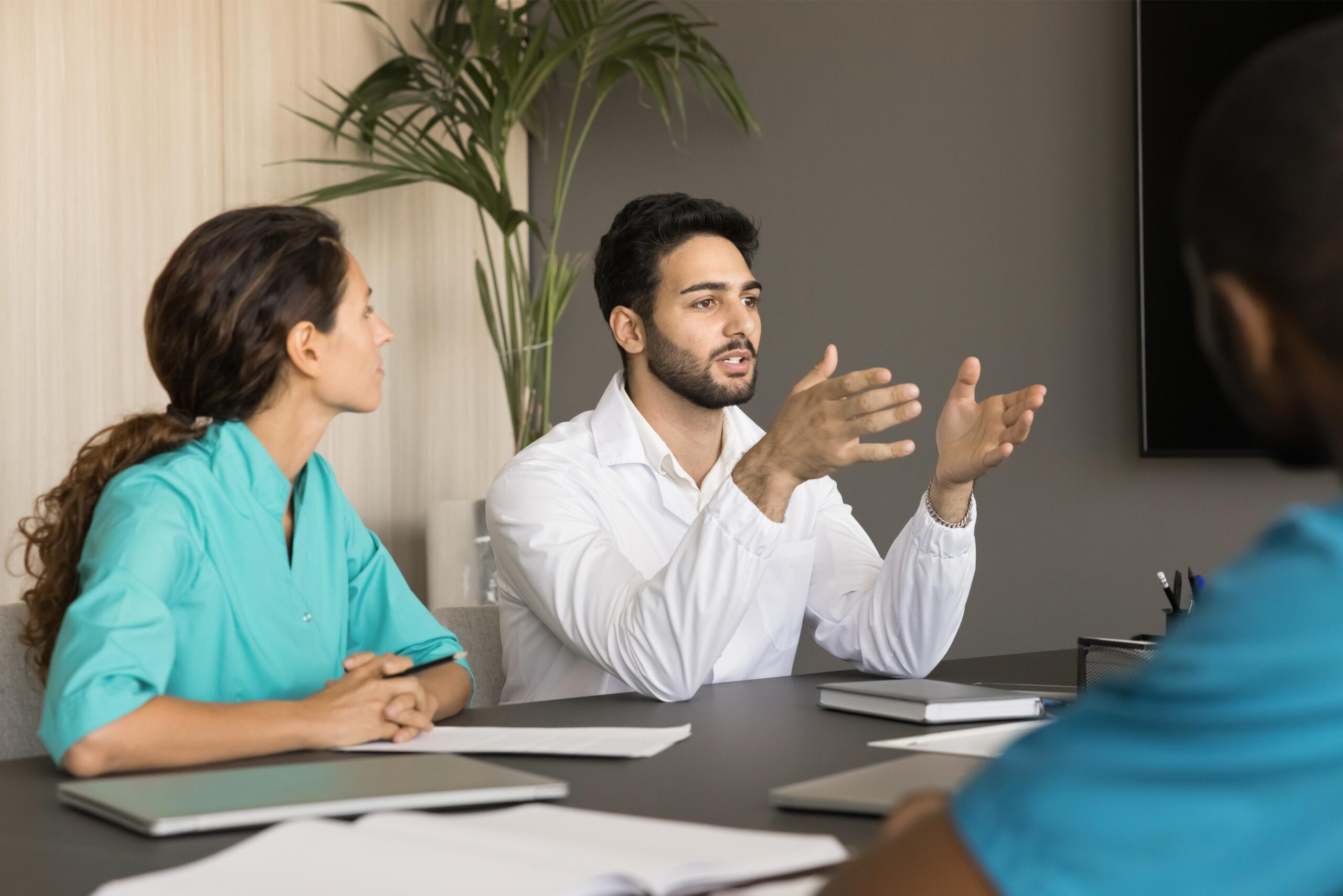 Doctor reaching hand out to shake