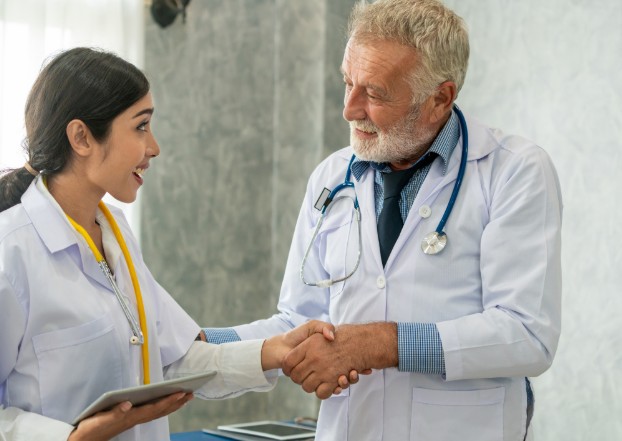 A Gen Z vet working with an older, veteran vet